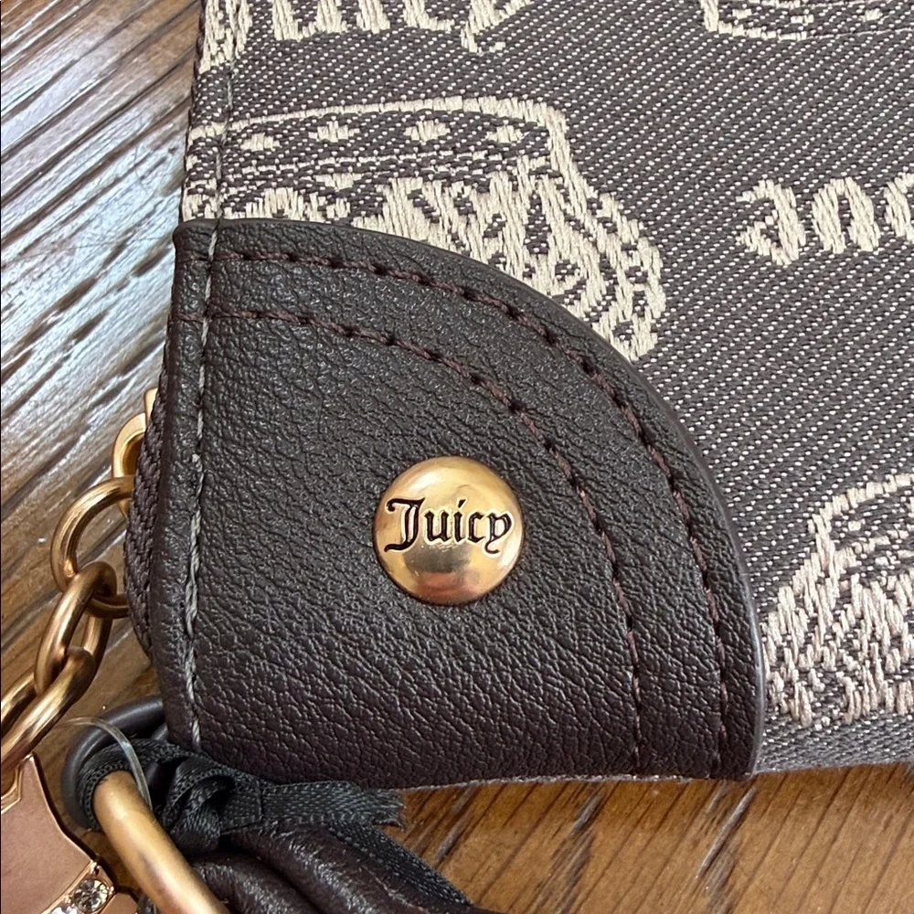 Juicy Couture Love & Crown Logo Wristlet. Zip around. Brown and tan color.